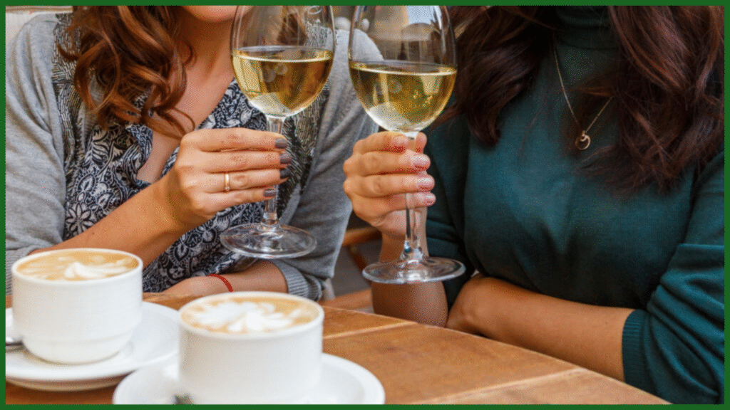 Two people enjoying coffee and white wine, illustrating the importance of limiting caffeine and alcohol in the evening to promote better sleep quality.